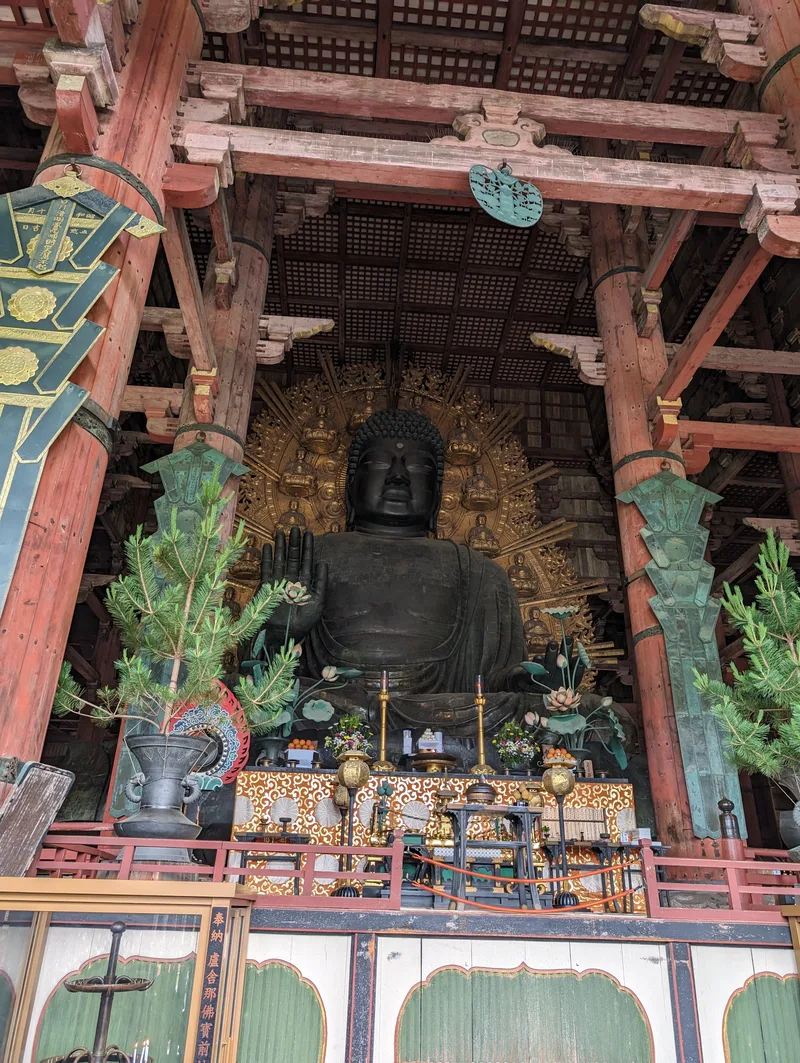 Close-up of the large bronze Buddha statue inside Todai-ji Temple's Daibutsuden in Nara, Japan.