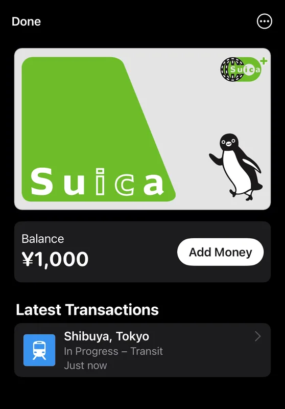 Mobile wallet showing a green Suica transit card with a 1,000 yen balance and a recent Shibuya tap in Tokyo, Japan