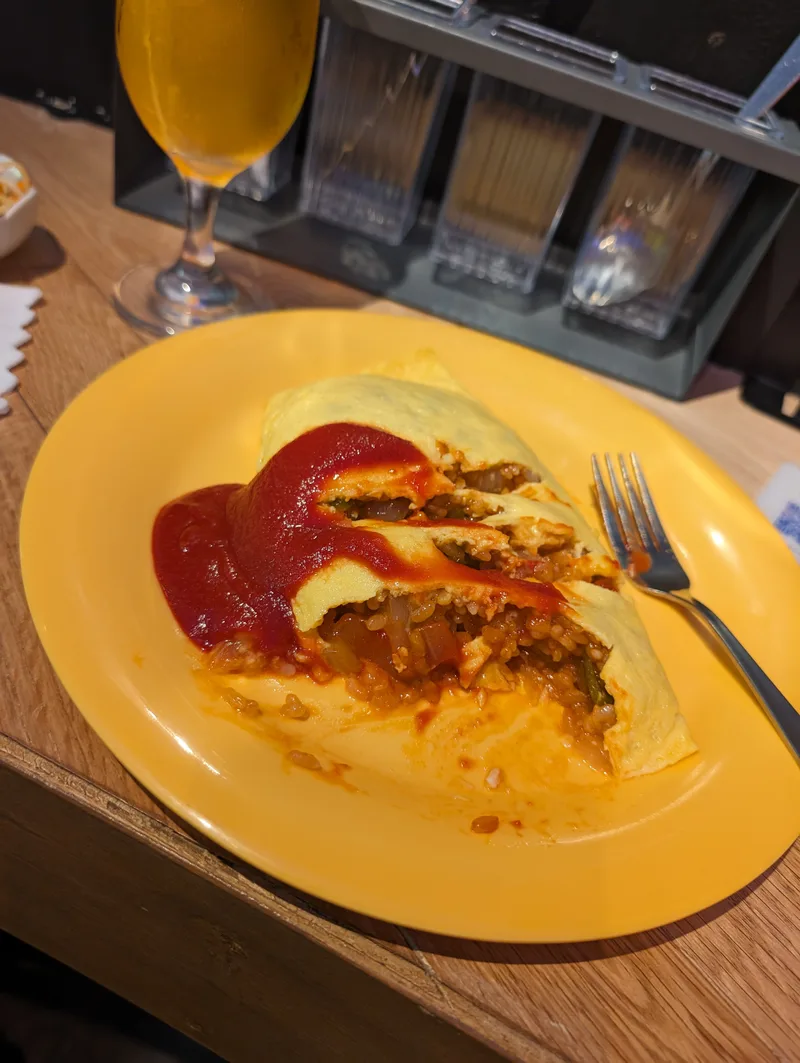 Omurice cut open to reveal the fried rice filling inside, Tokyo, Japan.