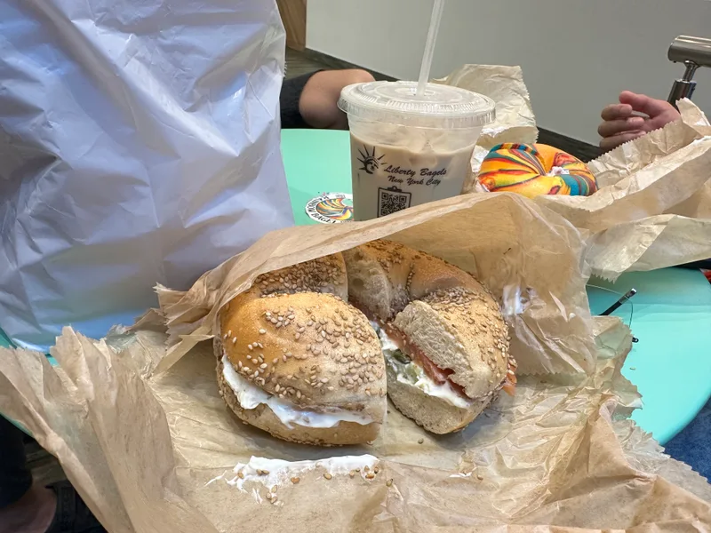 NYC bagels — sesame with lox and rainbow bagel with iced coffee