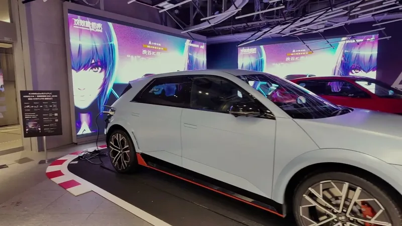 Hyundai Ioniq 5 N on display in Shibuya, Tokyo, Japan — matte blue, first time seeing one in person Light blue Hyundai Ioniq 5 N electric car on display indoors in Shibuya, Tokyo, Japan, with anime graphics on large digital screens in the background.