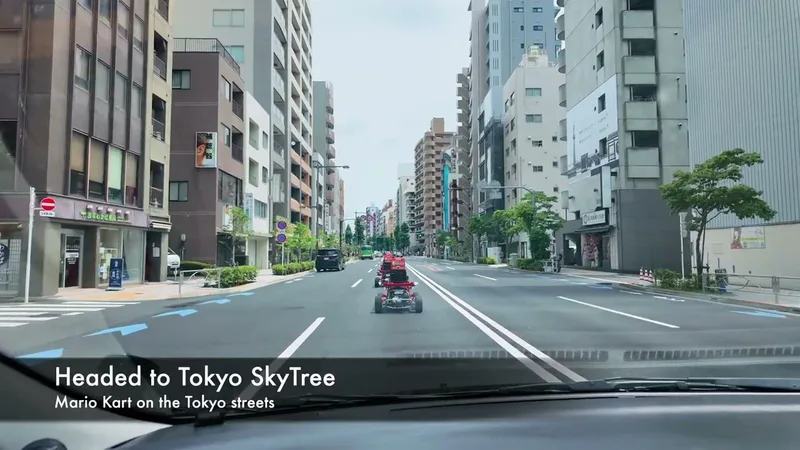 Mario Kart street experience on a public road in Tokyo, Japan View from car of a Tokyo city street with go-karts from a Mario Kart street experience, buildings and blue road arrows visible.