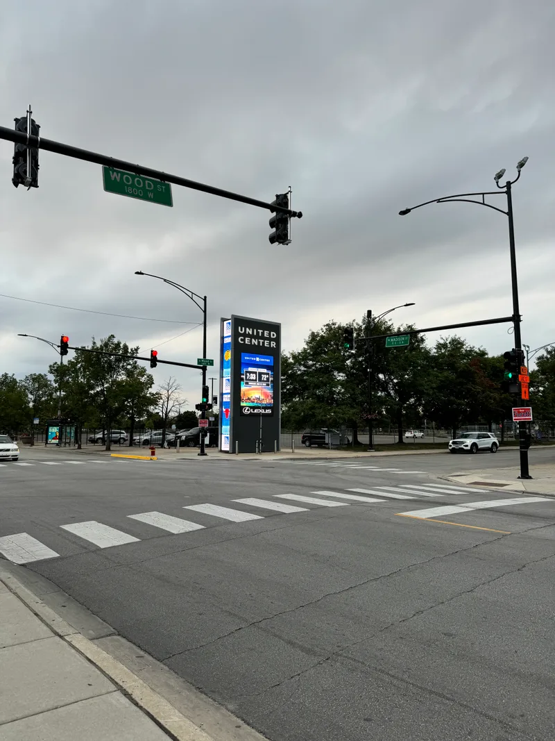 Street intersection with United Center digital sign at Madison and Wood, Chicago, Illinois