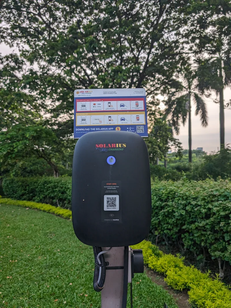 Solarius EVO EV charging station in green outdoor setting at Sofitel Philippine Plaza, Pasay, Metro Manila.